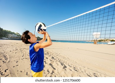 Teen Boy Passing Ball Playing Beach Volleyball