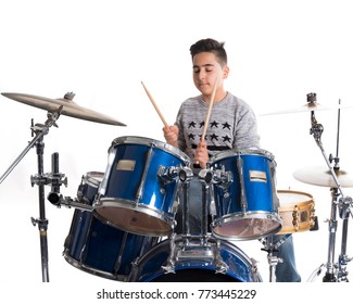 Teen Boy Plays The Drums In Studio Against White Background