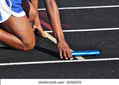 Teen Boy In The Starting Blocks At A Track Meet