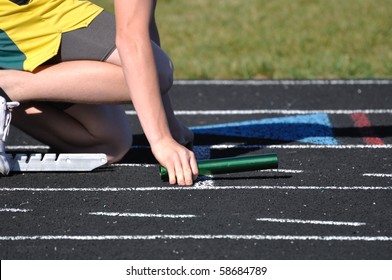 Teen Boy In The Starting Blocks At A Track Meet