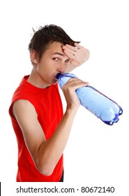 Teen Boy Wiping His Brow And Drinking Water From A Bottle.