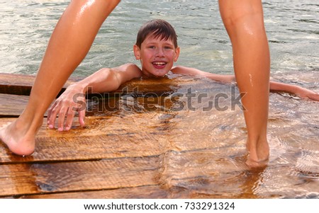 Teen Boys Swimming In The Lake On Hot Summer Day Close Up Photo Teen Boys Swimming In The Lake On Hot Summer Day Close Up Photo