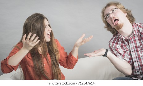 Teen Brother And Sister Having Horrible Fight While Sitting On Sofa. Friendship And Family Problems Concept.