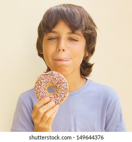 Teen  Caicasian Boy Licking His Lips At Sweet Donut