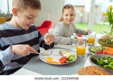 Teen children having healthy breakfast at home in the morning 