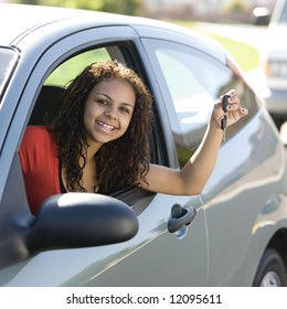 Teen Driver Inside Car With Keys Smiles