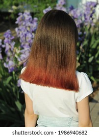 A Teen With Dyed Hair In The Popular Pink Color Has His Back Turned. 