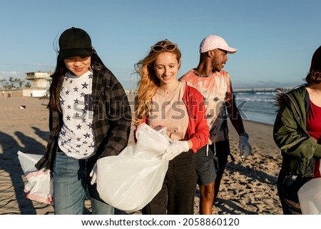 Similar – Image, Stock Photo Eco activist boy with banner “Wind Energy” on background of power stations for renewable electric energy production. Child and windmills. Wind turbines for generation electricity. Green energy