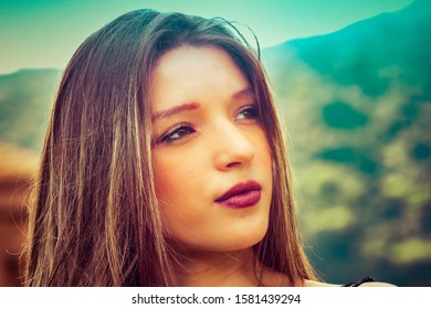 Teen Girl With Beautiful Blonde Hair And Soft Skin With Vacant Stare