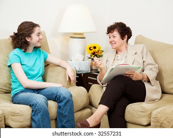 Teen Girl Being Interviewed By A Mature Woman.  Could Be College Or Job Interview, Or Counseling Session.