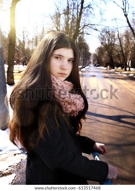 black coat teenage girl