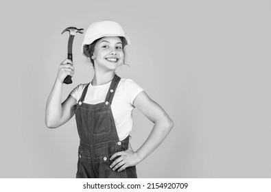 Teen Girl Builder In Protective Helmet Use Hammer, Protection, Copy Space