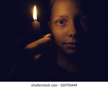 Teen Girl With A Candle, Fear On Her Face