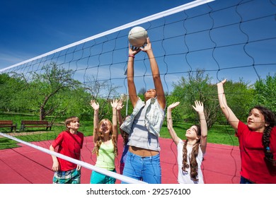 Teen Girl Catches The Ball During Volleyball Game