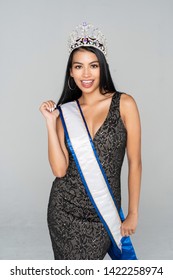 Teen Girl Competing In A Beauty Pageant With A Crown