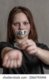 Teen Girl  Cuts Veins On A Hand With A Mouth Taped With The Inscription 