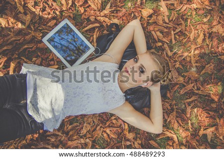 Similar – Image, Stock Photo Young redhead woman reading a red book