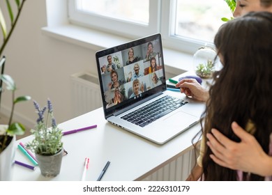 Teen Girl Distance Learning Virtual Distance Online Class On Video Call Virtual Lesson With Mother, Studying At Home Using Laptop Computer. Parent Or Tutor Helping Child Daughter With Remote Education