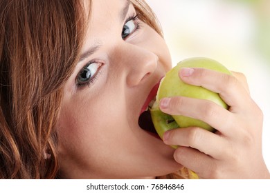 Teen Girl Eating Grean Apple Isolated On White Background