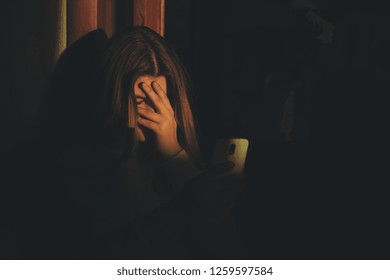 Teen Girl Excessively Sitting At The Phone At Home. He Is A Victim Of Online Bullying Stalker Social Networks - Image