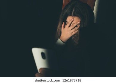 Teen Girl Excessively Sitting At The Phone At Home. She Is A Victim Of Online Bullying Stalker Social Networks - Image