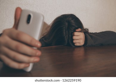 Teen Girl Excessively Sitting At The Phone At Home. She Is A Victim Of Online Bullying Stalker Social Networks - Image