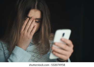 Teen Girl Excessively Sitting At The Phone At Home. He Is A Victim Of Online Bullying Stalker Social Networks