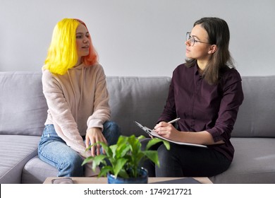 Teen Girl Giving Interview To Social Worker. School Psychologist Talking With Student, Counseling, Therapy, Help And Support For Adolescents