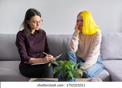 Teen Girl Giving Interview To Social Worker. School Psychologist Talking With Student, Counseling, Therapy, Help And Support For Adolescents