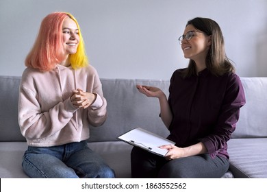 Teen Girl Giving Interview To Social Worker. School Psychologist Talking With Student, Counseling, Therapy, Help And Support For Adolescents