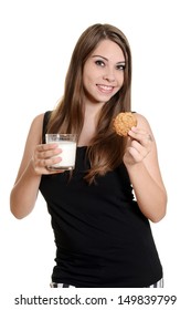 Teen Girl With Glass Milk And Oatmeal Cookie