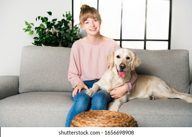 A Teen Girl with her golden retreiver dog