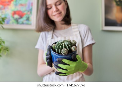 Teen Girl Holding Cactus In Pot. Hobbies And Leisure, Home Gardening, Houseplant, Potted Friends Concept