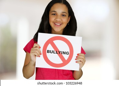 Teen Girl Holding A Card That Says No Bullying