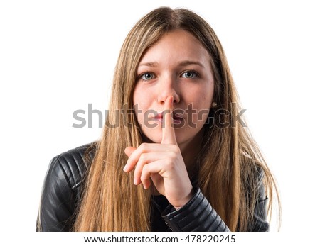 Teen girl making silence gesture