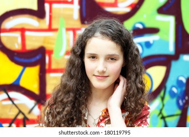 Teen Girl On Background Of The Graffiti .