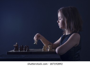 Teen Girl Playing Chess