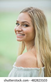 Teen Girl Poses For A High School Senior Portrait Photo Outdoors