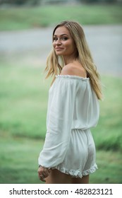 Teen Girl Poses For A High School Senior Portrait Photo Outdoors