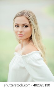 Teen Girl Poses For A High School Senior Portrait Photo Outdoors