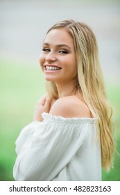 Teen Girl Poses For A High School Senior Portrait Photo Outdoors