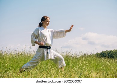 Teen Girl Practicing Karate Kata Outdoors