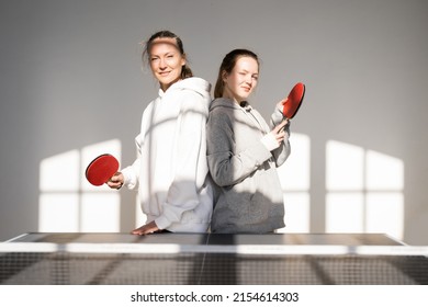 Teen Girl Preparing To Playing Ping Pong With Her Mom, Sports Games