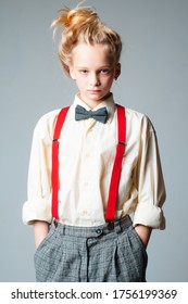 Teen Girl In Retro Male Suit. Retro Fashion Model. Vintage Charleston Party. Jazz Step Fashion Suspender And Bow Tie. Old Fashioned Child Vintage English Style. Open And Sociable.