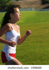 Teen Girl Running On The Stadium