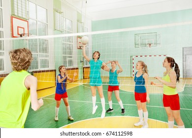 Teen Girl Serving The Ball During Volleyball Match