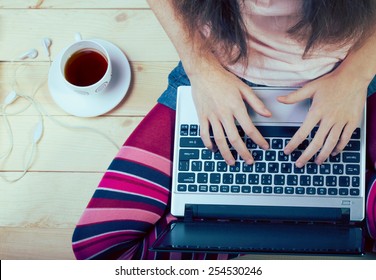 Teen Girl Sitting With A Laptop
