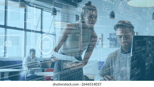 Teen girl in striped skirt and top manipulating digital interface overlays in office, with monitors. Technology, collaboration, innovation, digital, workspace, modern, productivity