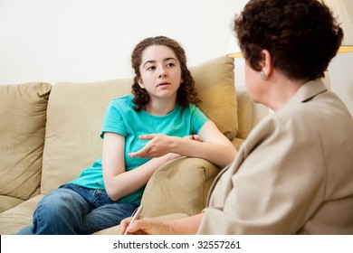 Teen Girl Talking To A Female Counselor. Could Also Be Job Or College Interview.