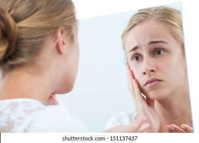 Teen Girl Unhappy With Their Appearance In Mirror